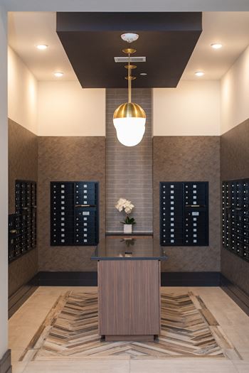 A lobby with a table and a vase